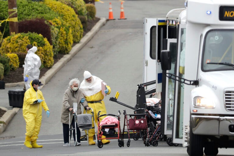 Residents from St. Joseph's Senior Home are helped on to buses in Woodbridge