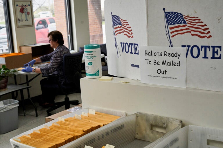 In this April 14, 2020 photo, mail-in ballots are ready to be mailed. (AP Photo/Nati Harnik)