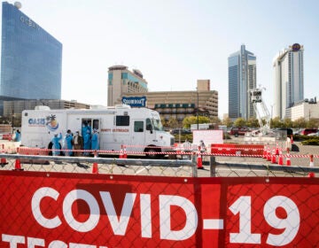 Medical workers prepare for the opening of a COVID-19 test location in a parking lot near the casinos in Atlantic City, Pa., Tuesday, April 28, 2020. (AP Photo/Matt Rourke)