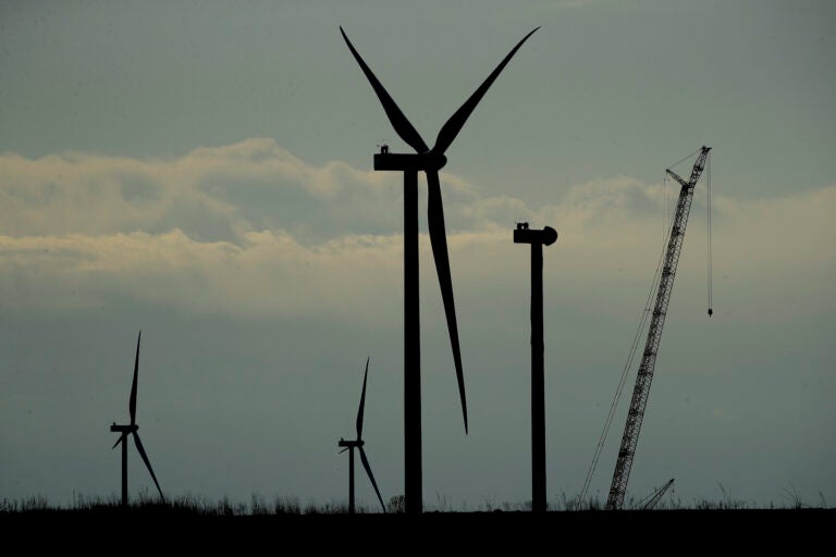 Wind turbines stand in various stages of completion at the Reading Wind Facility in Reading, Kan., on Thursday, April 23, 2020. (AP Photo/Charlie Riedel)