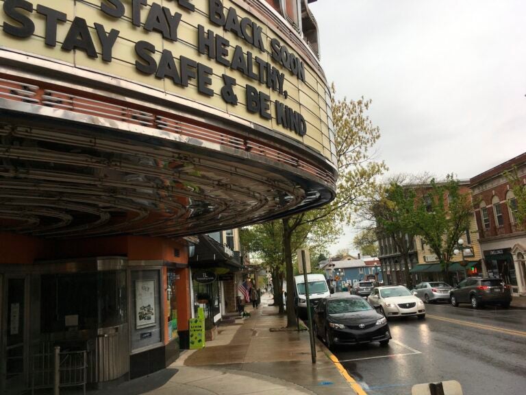The marquee of the Campus Theatre in downtown Lewisburg, P.a, on Friday, May 8, 2020, tells moviegoers it hopes to reopen soon. Some of the retail shops in the town’s Market Street shopping strip reopened after about two months on Friday, with a  trickle of customers, as Union County was considered to be safe enough to begin to loosen social distancing restrictions. (AP Photo/Mark Scolforo)