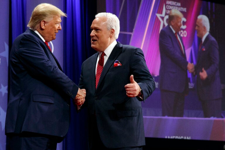 In this Feb. 29, 2020, file photo, President Donald Trump is greeted by Matt Schlapp, Chairman of the American Conservative Union, as the president arrives to speak at the Conservative Political Action Conference,  at National Harbor, in Oxon Hill, Md. (AP Photo/Jacquelyn Martin, File)