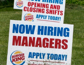 A row of signs advertising jobs are posted in front of a Burger King restaurant, Thursday, May 21, 2020, in Harmony, Pa. (AP Photo/Keith Srakocic)