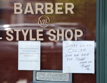 A Seattle barber shop remains closed because of the coronavirus outbreak on May 19. Last week, an additional 2.1 million people filed for unemployment benefits around the country.