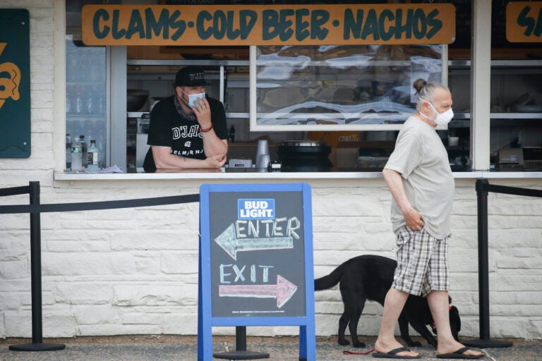 Customer wears face mask in Belmar, N.J.