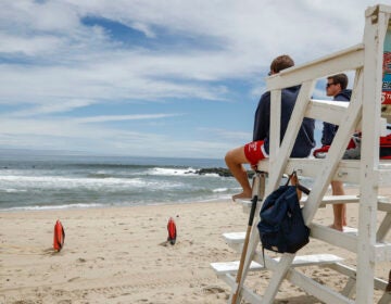 Lifeguards keep watch at a beach