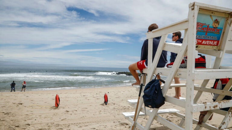 Lifeguards keep watch at a beach