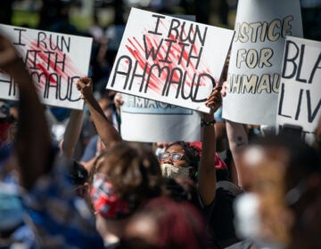 Demonstrators protest the shooting death of Ahmaud Arbery