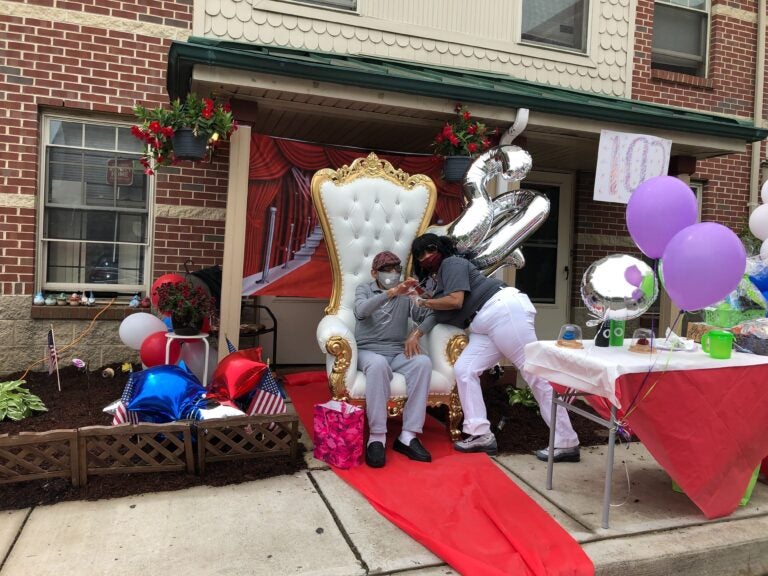 Narberth Rice poses with granddaughter Harriet Rice at his 102nd birthday celebration. (Layla A. Jones/WHYY)