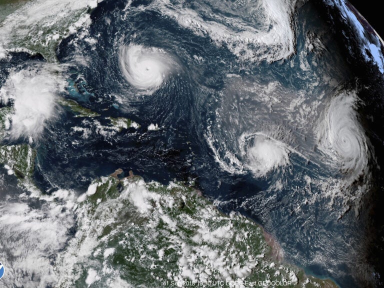 Three hurricanes form in the Atlantic in September 2018. Forecasters predict three to six major hurricanes during the 2020 season, which is above average. (NOAA via AP)