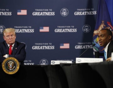 President Trump listens as Scott Turner, executive director of the White House Opportunity and Revitalization Council, speaks during a meeting with African American leaders in Michigan on Thursday. (Alex Brandon/AP Photo)