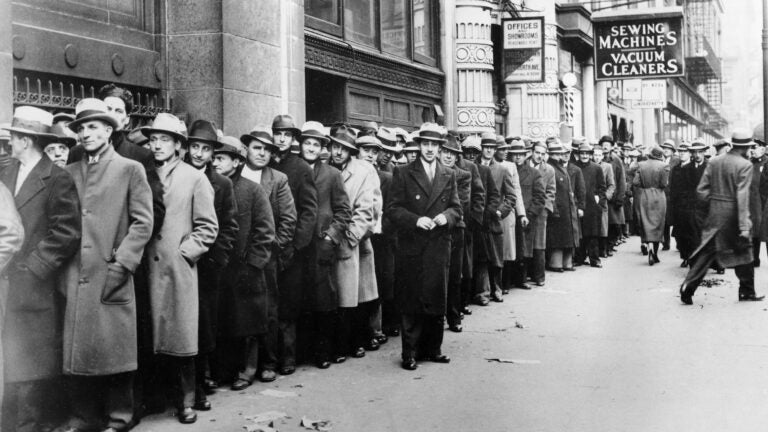 Unemployed people wait outside the state Labor Bureau in New York City in 1933.