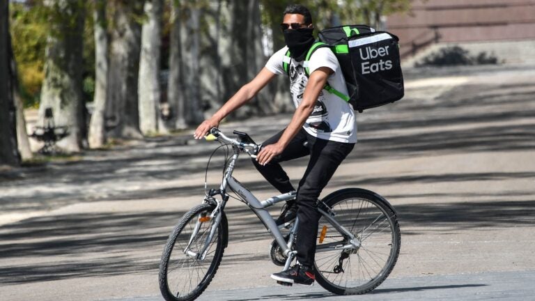 Uber is restructuring its business to focus on rides and food delivery, which has been a bright spot for the company during the pandemic. (Pascal Guyot/AFP via Getty Images)