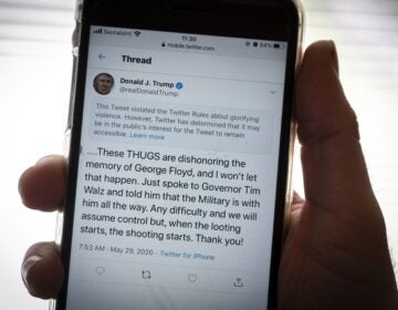 President Trump’s Twitter page is displayed on a mobile phone. The social media company flagged one of his tweets about Minneapolis as “glorifying violence” and hid it from public view unless a user clicks on it. President Trump's Twitter page is displayed on a mobile phone. The social media company flagged one of his tweets about Minneapolis as