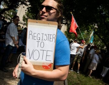 A voter registration volunteer in Philadelphia in 2018. New registrations had surged going into 2020 but have dropped off dramatically as a result of the coronavirus pandemic. (Dominick Reuter/AFP via Getty Images)