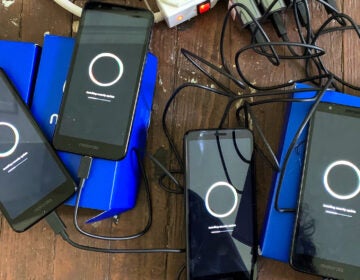 Motorola E6 smartphones charging up before delivery to people leaving Philly jails. NAOM KEIM / THE CENTER FOR CARCERAL COMMUNITIES