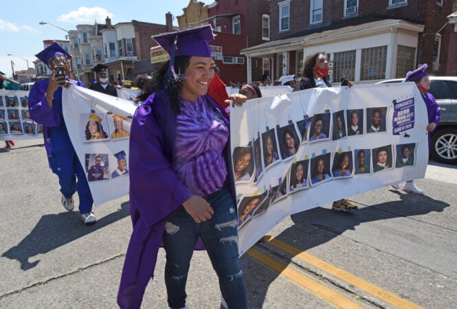 During the parade on June 26, Brimm graduate Iyana Lugo, 18, carried a banner. 