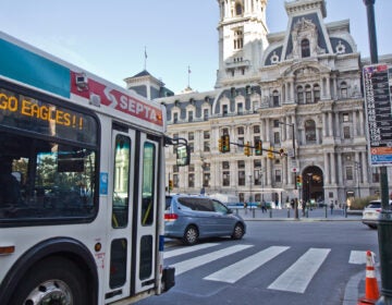 A SEPTA bus approaches City Hall in a bus lane.
