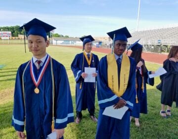 North Penn High School valedictorian Tony Xu (left) joins other graduation speakers at the high school stadium in Lansdale, where they delivered their speeches for a video recording. (Peter Crimmins/WHYY)