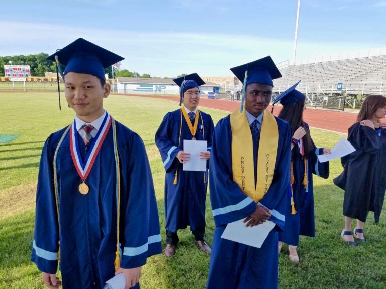 North Penn High School valedictorian Tony Xu (left) joins other graduation speakers at the high school stadium in Lansdale, where they delivered their speeches for a video recording. (Peter Crimmins/WHYY)