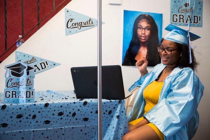 Aliah Harris smiles as her name is called during Paul Robeson High School's Zoom graduation ceremony. (Rachel Wisniewski for Keystone Crossroads)