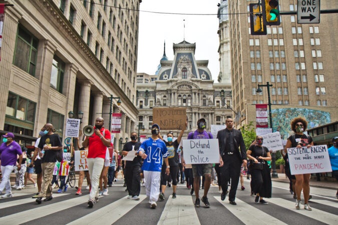 Members of the Omega Psi Phi Fraternity organized a March from the Octavius Catto statute at City Hall to the African American History Museum in Philadelphia calling for equality and justice. (Kimberly Paynter/WHYY)