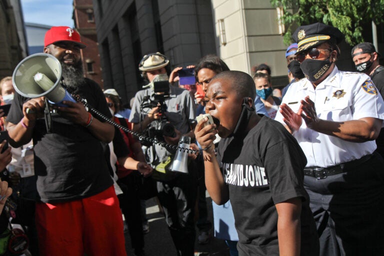 Isaac Gardner, 11, joined chief defender Keir Bradford-Grey and Philadelphia County Sheriff Rochelle Bilal in protest of the Black lives lost to police brutality. (Kimberly Paynter/WHYY)
