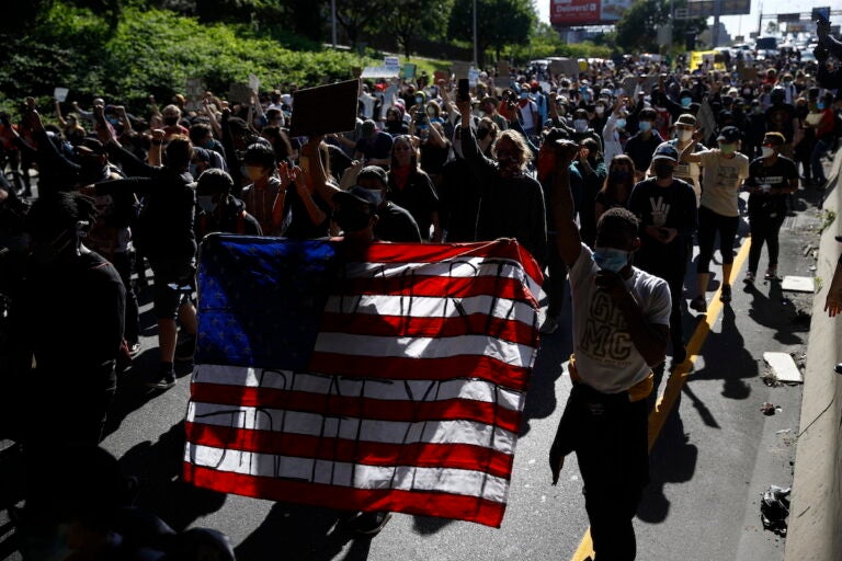 Protesters march down Interstate 676 in Philadelphia, Monday, June 1, 2020 in the aftermath of protest and unrest in reaction to the death of George Floyd. (AP Photo/Matt Rourke)
