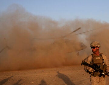 In this Aug. 27, 2017 file photo, a U.S. Marine takes part during a training session for Afghan army commandos in Shorab military camp in Helmand province, Afghanistan. (AP Photo/Massoud Hossaini, File)