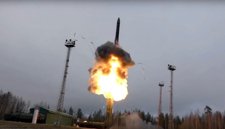 In this photo an intercontinental ballistic missile lifts off from a truck-mounted launcher somewhere in Russia. The Russian military said the Avangard hypersonic weapon entered combat duty. The Kremlin has made modernization of Russia's strategic nuclear forces one of its top priorities. (Russian Defense Ministry Press Service via AP)