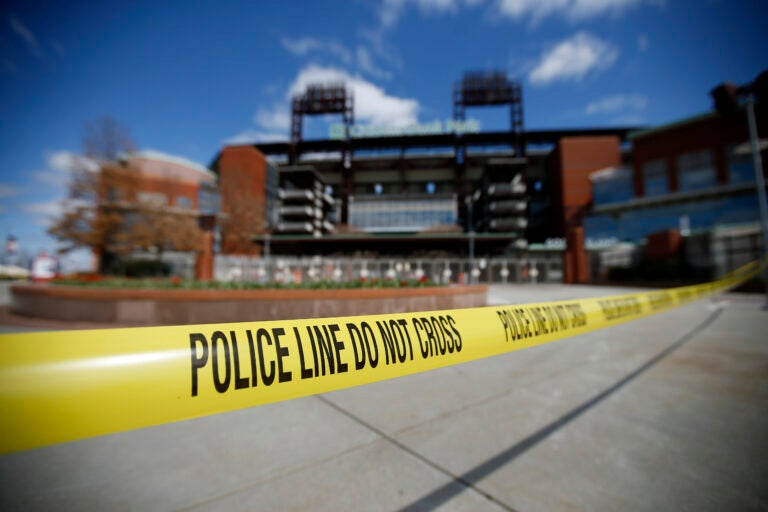 Police tape blocks an entrance to Citizens Bank Park, home of the Philadelphia Phillies baseball team, Tuesday, March 24, 2020, in Philadelphia. (AP Photo/Matt Slocum)