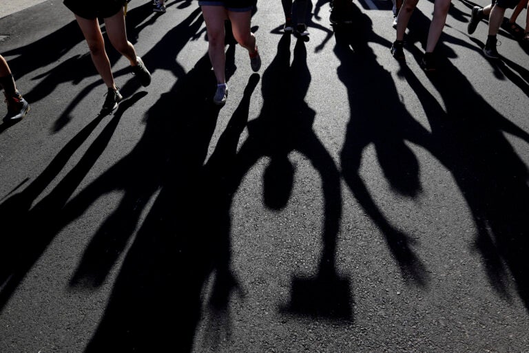 Protesters raise their hands as they march over the deaths of George Floyd and Breonna Taylor, Monday, June 1, 2020, in Louisville, Ky. Breonna Taylor, a black woman, was fatally shot by police in her home in March.  (AP Photo/Darron Cummings)