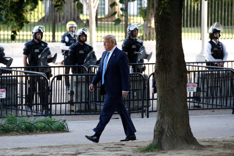 President Donald Trump walks in Lafayette Park to  visit outside St. John's Church across from the White House Monday, June 1, 2020, in Washington. Part of the church was set on fire during protests on Sunday night. (AP Photo/Patrick Semansky)