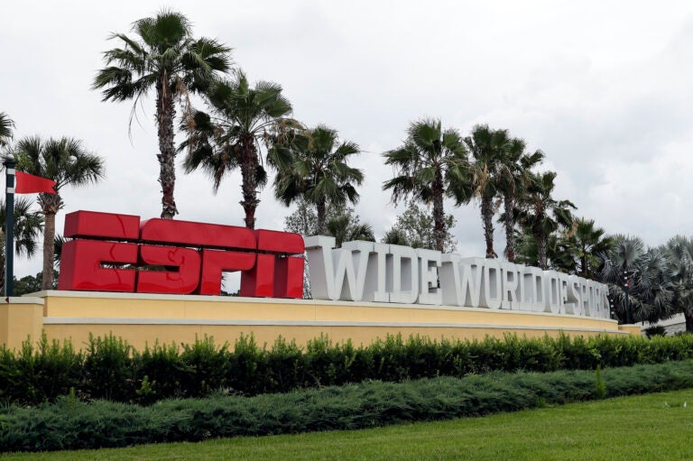 A sign marking the entrance to ESPN's Wide World of Sports at Walt Disney World is seen Wednesday, June 3, 2020, in Kissimmee, Fla. (AP Photo/John Raoux)