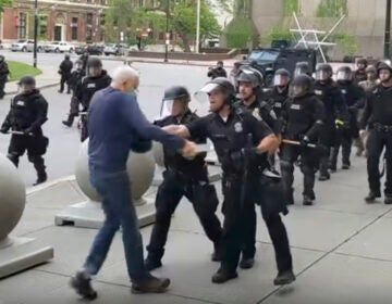 In this image from video provided by WBFO, a Buffalo police officer appears to shove a man who walked up to police Thursday, June 4, 2020, in Buffalo, N.Y. (Mike Desmond/WBFO via AP)