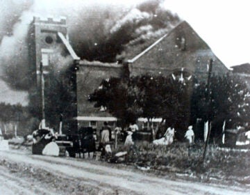 FILE - In this 1921 file image provided by the Greenwood Cultural Center via Tulsa World, Mt. Zion Baptist Church burns after being torched by white mobs during the 1921 Tulsa massacre. Black community and political leaders called on President Donald Trump to at least change the Juneteenth date for a rally kicking off his return to public campaigning, saying Thursday, June 11, 2020. From Sen. Kamala Harris of California to Tulsa civic officials, black leaders said it was offensive for Trump to pick that date — June 19 — and that place — Tulsa, an Oklahoma city that in 1921 was the site of a fiery and orchestrated white-on-black killing spree. (Greenwood Cultural Center via Tulsa World via AP)