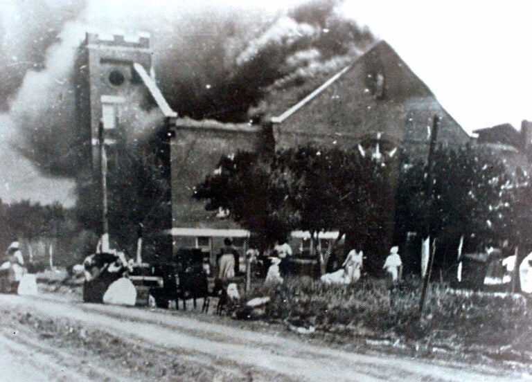 FILE - In this 1921 file image provided by the Greenwood Cultural Center via Tulsa World, Mt. Zion Baptist Church burns after being torched by white mobs during the 1921 Tulsa massacre. Black community and political leaders called on President Donald Trump to at least change the Juneteenth date for a rally kicking off his return to public campaigning, saying Thursday, June 11, 2020. From Sen. Kamala Harris of California to Tulsa civic officials, black leaders said it was offensive for Trump to pick that date — June 19 — and that place — Tulsa, an Oklahoma city that in 1921 was the site of a fiery and orchestrated white-on-black killing spree. (Greenwood Cultural Center via Tulsa World via AP)