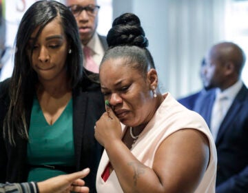 Tomika Miller, center, widow of Rayshard Brooks cries as she leaves a news conference, Wednesday, June 17, 2020 in Atlanta. Fulton County District Attorney Paul L. Howard Jr. announced former Atlanta Police Officer Garrett Rolfe faces charges including felony murder in the fatal shooting of Rayshard Brooks on June 12. (AP Photo/Byrnn Anderson)