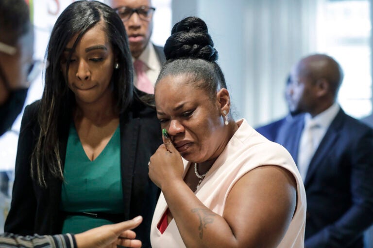 Tomika Miller, center, widow of Rayshard Brooks cries as she leaves a news conference, Wednesday, June 17, 2020 in Atlanta. Fulton County District Attorney Paul L. Howard Jr. announced former Atlanta Police Officer Garrett Rolfe faces charges including felony murder in the fatal shooting of Rayshard Brooks on June 12. (AP Photo/Byrnn Anderson)