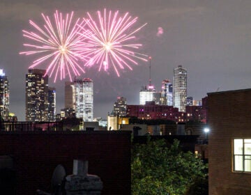 Fireworks explode during Juneteenth celebrations above the Bedford-Stuyvesant neighborhood in the Brooklyn borough of New York, Friday, June 19, 2020. (AP Photo/John Minchillo)