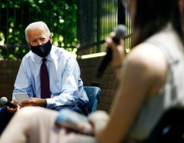 Democratic presidential candidate, former Vice President Joe Biden, left, listens to Laura Raslevich, of Pittsburgh, during a meeting with families who have benefited from the Affordable Care Act, Thursday, June 25, 2020, in Lancaster, Pa. (AP Photo/Matt Slocum)