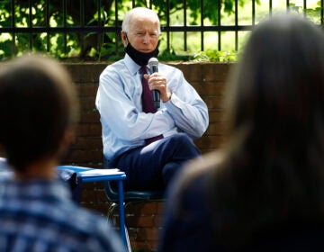 Democratic presidential candidate, former Vice President Joe Biden, center, speaks to Stacie Ritter, right, and her son, Jan, during a meeting with families who have benefited from the Affordable Care Act, Thursday, June 25, 2020, in Lancaster, Pa. (AP Photo/Matt Slocum)