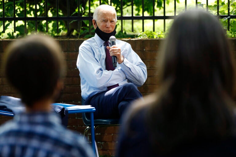 Democratic presidential candidate, former Vice President Joe Biden, center, speaks to Stacie Ritter, right, and her son, Jan, during a meeting with families who have benefited from the Affordable Care Act, Thursday, June 25, 2020, in Lancaster, Pa. (AP Photo/Matt Slocum)