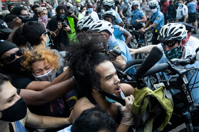 Police and protesters clash in Philadelphia