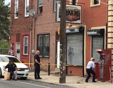 Police are seen on the scene of an ATM explosion in Philly