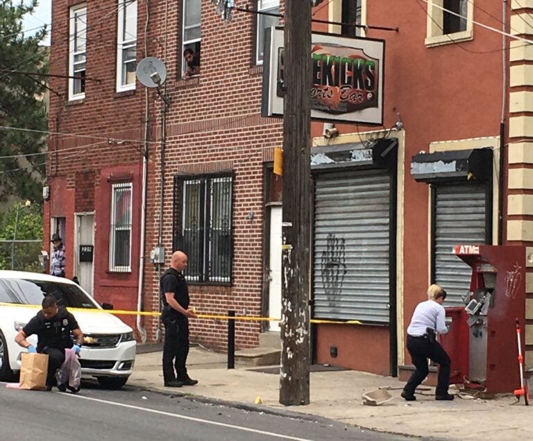 Police are seen on the scene of an ATM explosion in Philly