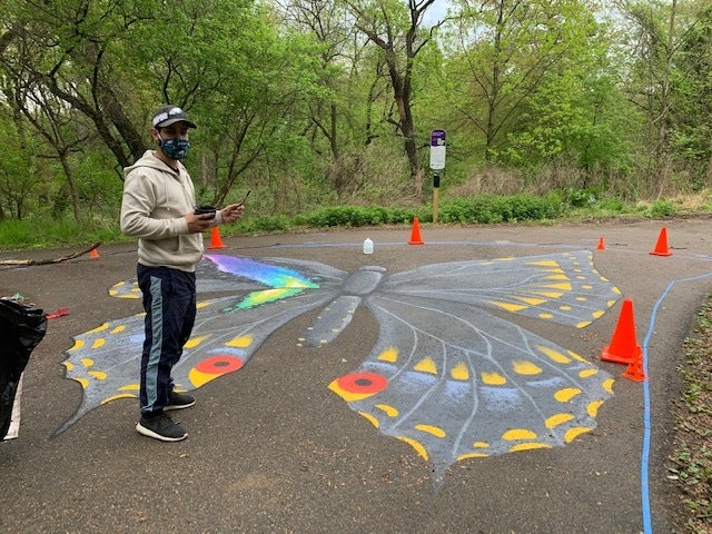 Jay Coreano’s street murals in progress at Tacony Creek Park. (Courtesy of Julie Slavet/TTF Watershed Partnership)