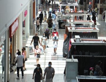 Shoppers flock to the Cherry Hill Mall in New Jersey, although many stores are not yet open. (Emma Lee/WHYY)