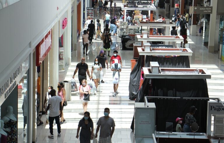 Shoppers flock to the Cherry Hill Mall in New Jersey, although many stores are not yet open. (Emma Lee/WHYY)