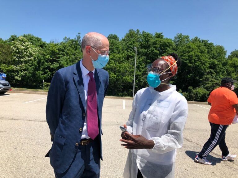 Philadelphia Health Commissioner Thomas Farley speaks with Dr. Ala Stanford, head of the Black Doctors COVID-19 Consortium. (Nina Feldman/WHYY)